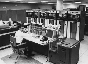 person working on IBM 7094